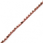 Perline sfaccettate rosa vintage metallico