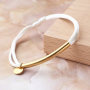 Realizza braccialetti colorati con cordoncino di raso e distanziatori in acciaio inox 